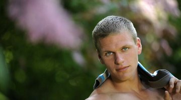 Muscle stud posing naked outdoors